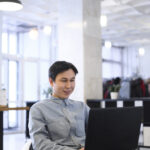 high-angle-man-working-laptop