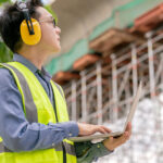 smart asian glasses engineer use radio connection working in site construction
